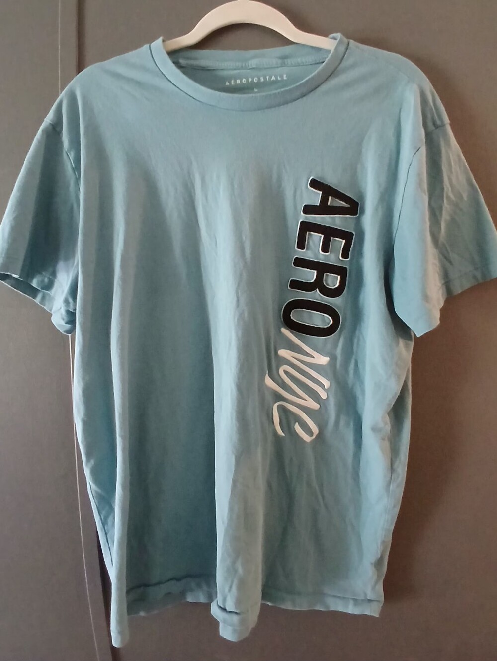 Aeropostale men's light blue t-shirt, large vertical graphic down the side L